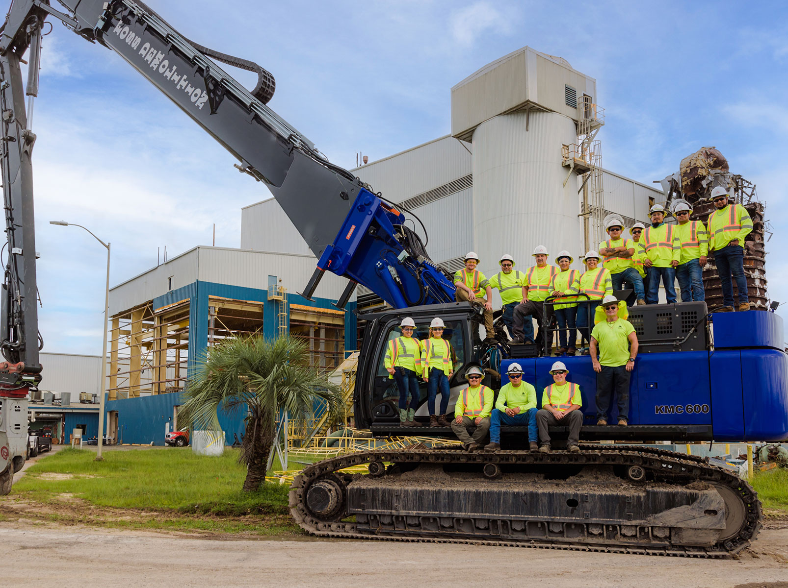 Foss team standing on excavator